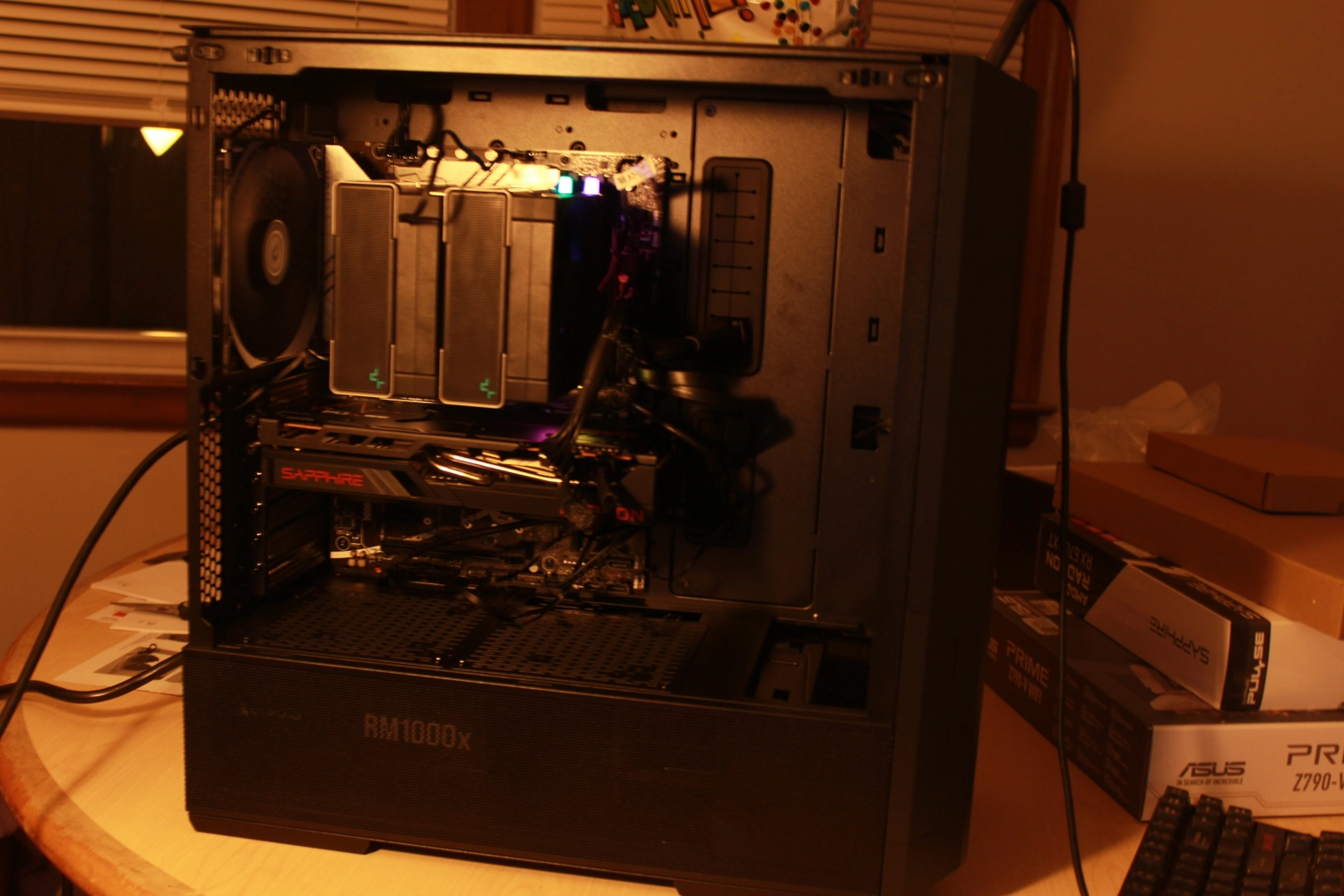 a white pc standing on a wooden table