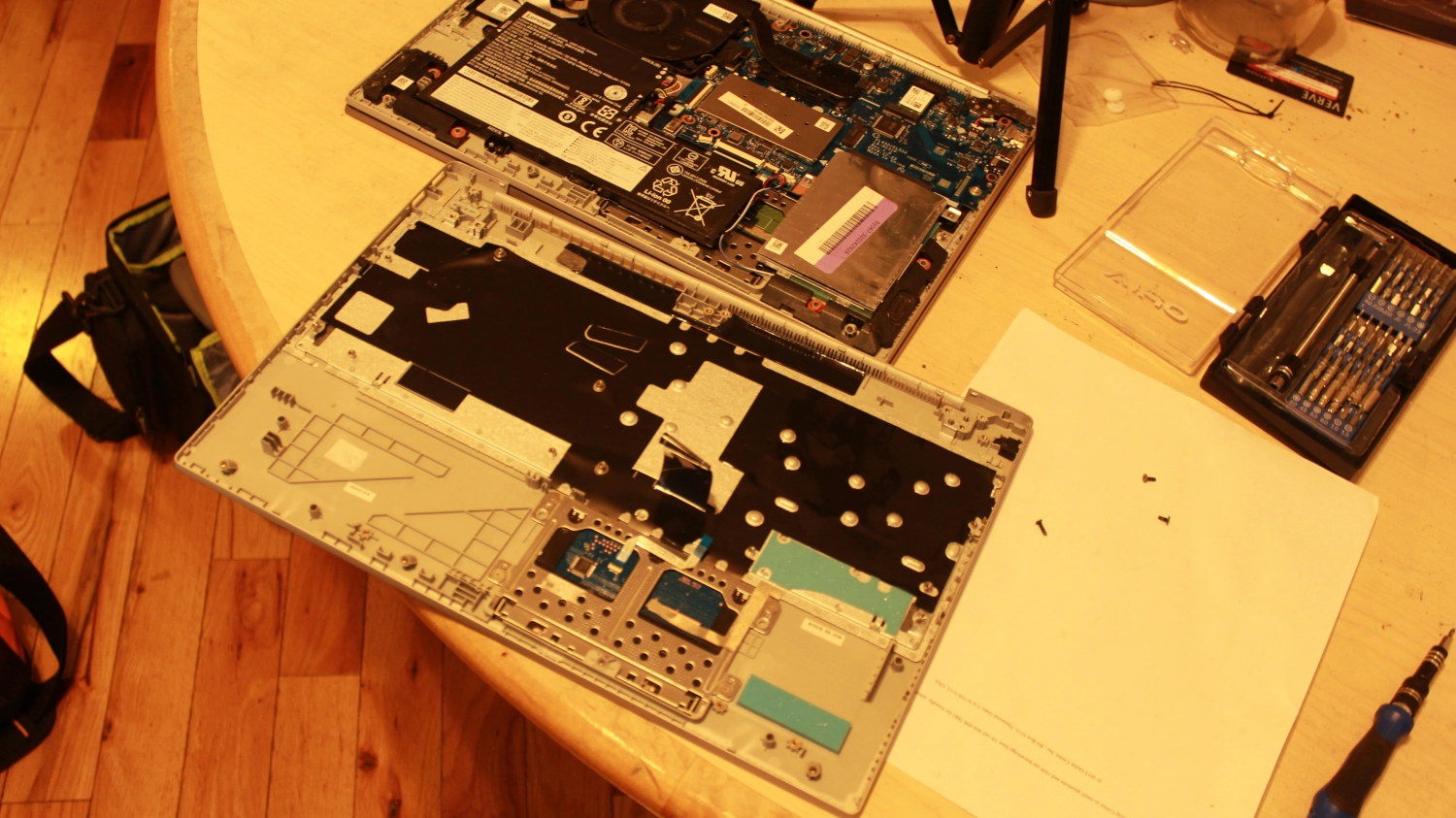 a white pc standing on a wooden table